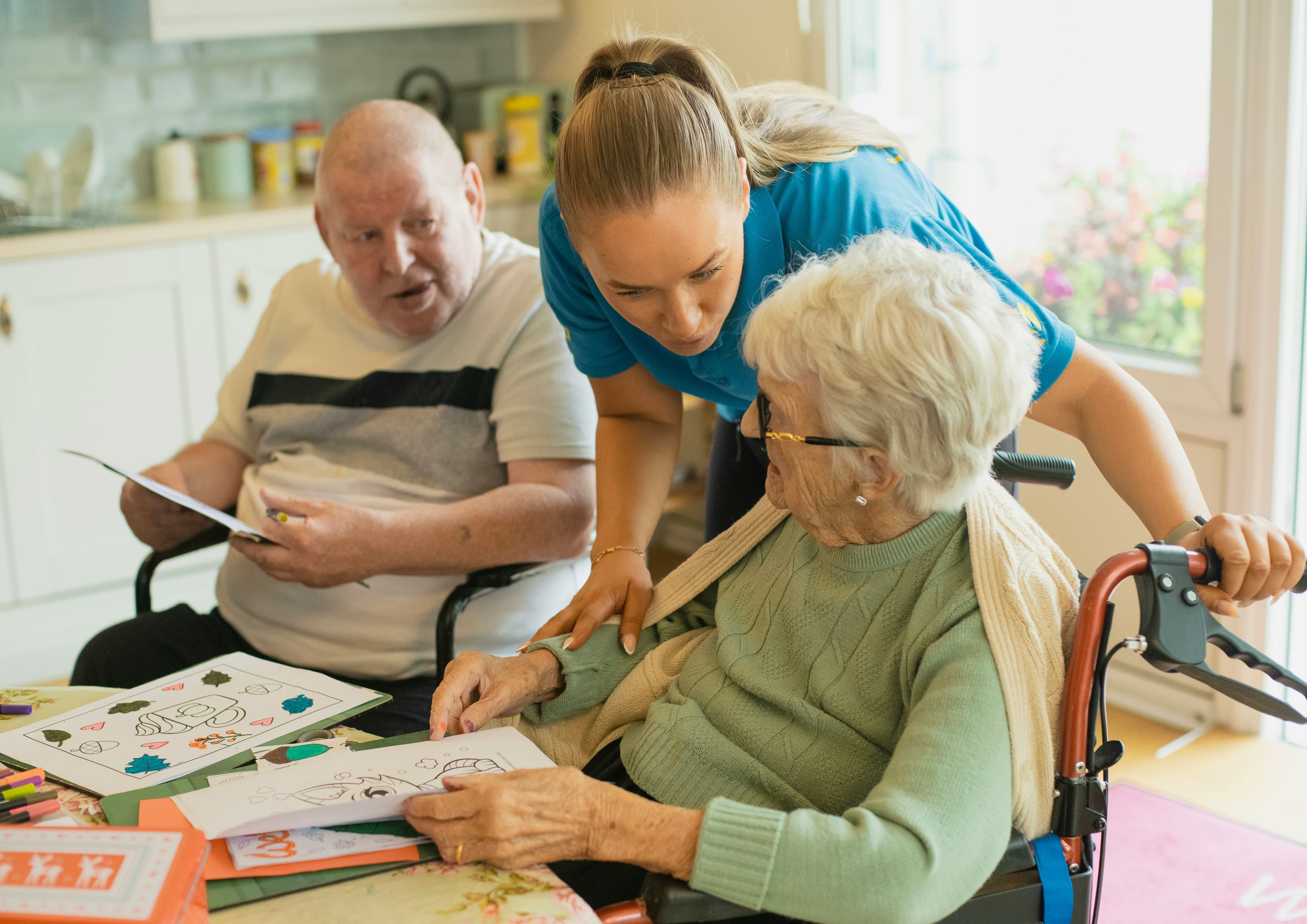 A BrevCare caregiver sharing a warm moment with clients at home